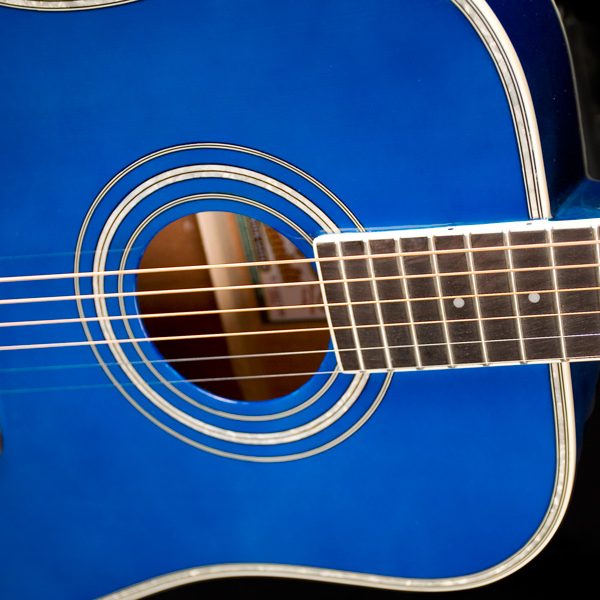 body of blue Oscar Schmidt acoustic guitar